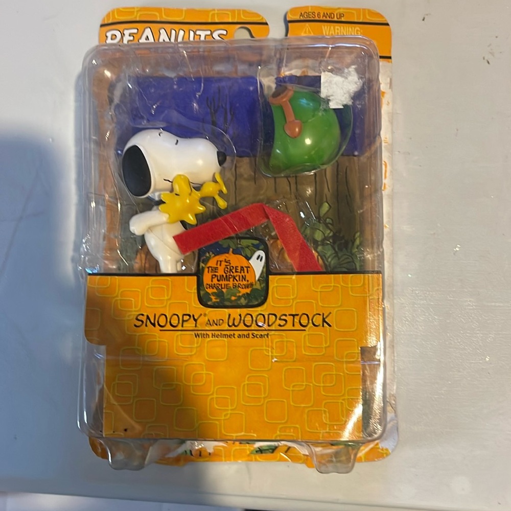 Peanuts Charlie, Brown, Snoopy, and Woodstock with helmet and scarf figurines